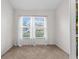 Cozy, carpeted home office featuring bright window and neutral wall paint at 4196 Hoffman Ave, Spring Hill, FL 34606