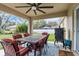 Covered patio features an outdoor dining set, ceiling fan and a grill; great for entertaining and outdoor dining at 4196 Hoffman Ave, Spring Hill, FL 34606