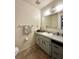 A view of the bathroom featuring a vanity with drawers, a large mirror, and a clean, modern design at 4622 Blossom Blvd # D, Zephyrhills, FL 33542