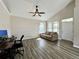 Bright living room with vaulted ceiling, modern flooring, and large windows and natural light at 6212 Abbott Station Dr, Zephyrhills, FL 33542