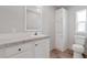 Bathroom featuring a vanity, mirror, storage cabinet, and toilet at 13024 Dania St, Hudson, FL 34667