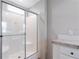 Bathroom showcasing a large shower with glass door and a modern vanity at 13024 Dania St, Hudson, FL 34667