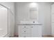 Bathroom featuring a sleek vanity, mirror, and a large shower with glass door at 13024 Dania St, Hudson, FL 34667