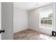 The bedroom offers newer flooring and paint, and a good amount of sunlight at 13024 Dania St, Hudson, FL 34667
