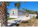 Single-story home with a newer exterior, easy lawn maintenance and convenient parking at 13024 Dania St, Hudson, FL 34667