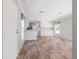 The open-concept living room has luxury vinyl flooring, newer paint, and abundant natural light at 13024 Dania St, Hudson, FL 34667