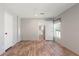 Living room showing wood-look floors and view into kitchen at 13024 Dania St, Hudson, FL 34667