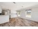 The living room offers an open concept with newer flooring and paint at 13024 Dania St, Hudson, FL 34667