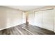 This is a Bedroom featuring wood floors, closet, and open door at 2140 N Bay Hills Blvd, Safety Harbor, FL 34695