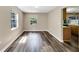 Cozy dining area with wood-look floors and natural light streaming in from the windows at 2140 N Bay Hills Blvd, Safety Harbor, FL 34695