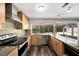 Well-equipped kitchen with granite countertops, stainless steel appliances, and ample cabinet space at 2140 N Bay Hills Blvd, Safety Harbor, FL 34695