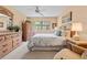 Tranquil bedroom featuring a queen bed, matching dressers, and a ceiling fan for added comfort at 2756 Clubhouse Dr # 101, Sarasota, FL 34232