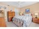 Inviting bedroom with a patterned comforter, side tables, and a view to the ensuite bath at 2756 Clubhouse Dr # 101, Sarasota, FL 34232