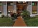 Inviting condo exterior with manicured landscaping and a walkway to the entrance at 2756 Clubhouse Dr # 101, Sarasota, FL 34232