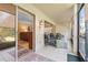 Inviting screened lanai with comfortable seating, a ceiling fan, and an open view into the living area at 2756 Clubhouse Dr # 101, Sarasota, FL 34232