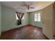 Bedroom with window, ceiling fan, and a wood floor at 655 36Th S Ave, St Petersburg, FL 33705