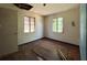 Bedroom with two windows, wood floors, and blue trim at 655 36Th S Ave, St Petersburg, FL 33705