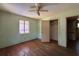 Bedroom featuring wood floors, window, ceiling fan, and closet at 655 36Th S Ave, St Petersburg, FL 33705