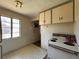Kitchen with white cabinets, window, and stove at 655 36Th S Ave, St Petersburg, FL 33705