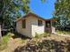 Exterior side view of home with mature trees at 655 36Th S Ave, St Petersburg, FL 33705