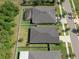 Aerial view of homes with fenced yards, a pool enclosure, and manicured lawns in a suburban neighborhood at 12905 Satin Lily Dr, Riverview, FL 33579