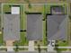 Aerial view of homes with manicured lawns and a screened in pool enclosure showcasing their neighborhood layout at 12905 Satin Lily Dr, Riverview, FL 33579