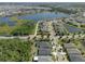 Stunning aerial view of homes in community, surrounded by lakes and lush landscapes at 12905 Satin Lily Dr, Riverview, FL 33579