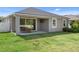 An ample backyard with a covered patio, offering outdoor entertainment and relaxation possibilities in a tranquil setting at 12905 Satin Lily Dr, Riverview, FL 33579