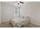 Bright bedroom with a ceiling fan, closet and a window for natural light at 12905 Satin Lily Dr, Riverview, FL 33579