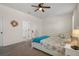 Comfortable bedroom with soft carpeting and natural light at 12905 Satin Lily Dr, Riverview, FL 33579