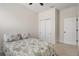 Bright bedroom with a ceiling fan, closet and comfortable bed at 12905 Satin Lily Dr, Riverview, FL 33579