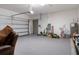 A spacious two car garage with room for vehicles and storage is equipped with a garage door opener and ample lighting at 12905 Satin Lily Dr, Riverview, FL 33579