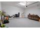 Spacious garage with plenty of storage, featuring smooth painted floor, and overhead door with automatic opener at 12905 Satin Lily Dr, Riverview, FL 33579