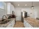 Well-appointed kitchen featuring granite counters, and stainless steel appliances at 12905 Satin Lily Dr, Riverview, FL 33579
