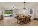 Bright living room with sliding glass doors, tile floors, and comfortable seating area at 12905 Satin Lily Dr, Riverview, FL 33579