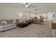 Inviting living space with tile floors, comfortable seating, and an open layout to the kitchen at 12905 Satin Lily Dr, Riverview, FL 33579