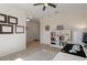 The office space offers great natural light and ample storage with a built in bookcase to compliment the neutral color palette at 12905 Satin Lily Dr, Riverview, FL 33579