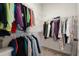 Spacious walk-in closet with ample shelving and hanging space for organized storage at 12905 Satin Lily Dr, Riverview, FL 33579