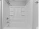 Clean white bathroom with shower and tub at 7105 N Whittier St, Tampa, FL 33617