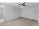 Bedroom featuring neutral paint and wood-look floors at 7105 N Whittier St, Tampa, FL 33617