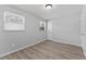 Bedroom with hardwood style floors and natural light at 7105 N Whittier St, Tampa, FL 33617