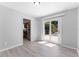 This dining room has wood-look flooring and sliding glass doors which fill the space with natural light at 7105 N Whittier St, Tampa, FL 33617