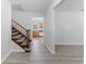 Open entryway showcasing the staircase and views of the kitchen and dining room at 7105 N Whittier St, Tampa, FL 33617