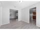 Spacious living area with wood-look floors with kitchen and entryway views at 7105 N Whittier St, Tampa, FL 33617