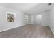 Spacious living room with wood-look flooring, lots of natural light, and neutral wall paint at 7105 N Whittier St, Tampa, FL 33617