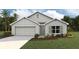 Charming single-story home with a well-manicured lawn and an attached two-car garage at 9114 Gibralter St, Spring Hill, FL 34608