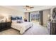 Cozy bedroom with a large window, plush carpet, and stylish furnishings for a relaxing retreat at 30940 Silver Stage Dr, Brooksville, FL 34602