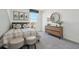 Bedroom with a plaid bed, two-tone paint, three-piece art, and dresser at 30948 Silver Stage Dr, Brooksville, FL 34602