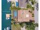 Aerial view showcasing a private pool, boat slip, and lush landscaping at 852 3Rd Ave S, Tierra Verde, FL 33715