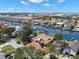 Beautiful aerial view of home, canal, and a private screened-in pool in a waterside community at 852 3Rd Ave S, Tierra Verde, FL 33715